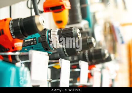 A Display of Power Tools Featuring Various Cordless Drills and Accessories for Home Improvement and DIY Projects Stock Photo