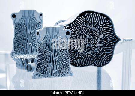 Objects heat exchanger with conformal cooling channels, filter or heat exchange element, turbine impeller printed on 3D printer. Models printed on 3D printer from metal powder. Selective Laser Melting Stock Photo