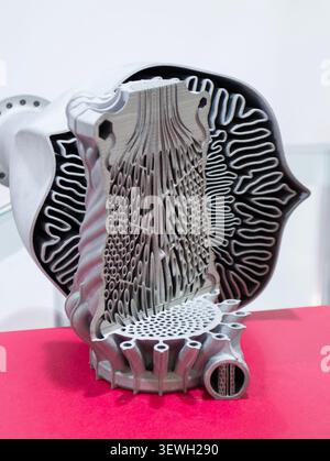 Objects heat exchanger with conformal cooling channels and turbine impeller printed on 3D printer. Models printed on 3D printer from metal powder. Selective Laser Melting. SLM. Additive manufacturing. Stock Photo