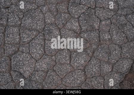 ABSTRACT BACKGROUND TEXTURE OLD CRACKED ASPHALT PAVEMENT Stock Photo