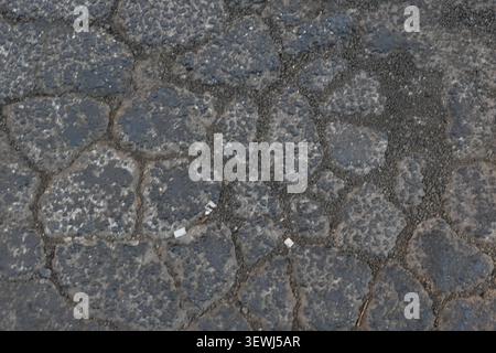 ABSTRACT BACKGROUND TEXTURE OLD CRACKED ASPHALT PAVEMENT Stock Photo