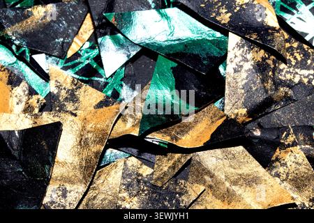 Gold metallic geometric triangle paint background on black paper Stock Photo