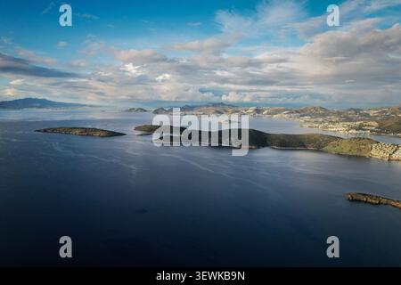 An aerial wide angle view displays several small, rocky islands scattered across the dark blue Aegean Sea, with the Bodrum peninsula visible in the ba Stock Photo