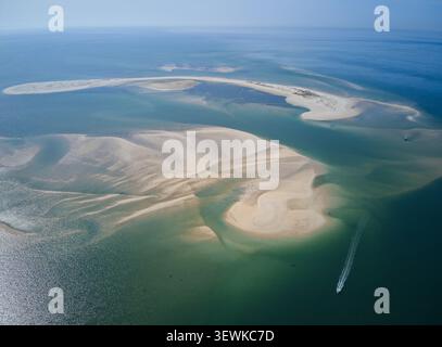 Aerial view of Sandbanks Beach featuring a white sandbar in turquoise ...