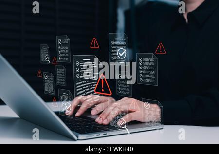 Document risk assessment and compliance warning concept. Person using laptop with files, red alert, checklist verification, audit review, data control Stock Photo