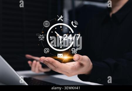 24/7 customer service support and AI helpdesk concept. virtual clock icons with chatbot, email, phone, tools, global access, automation, technical Stock Photo
