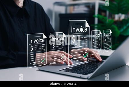 Invoice management and electronic billing system concept. Accountant using laptop with digital approved billing documents, e-invoices, online payment Stock Photo
