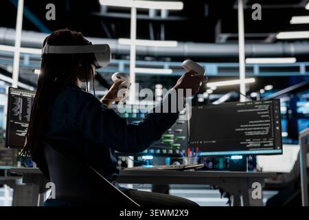 IT specialist uses a VR headset in a data center to manage AI systems, train neural networks, and configure hardware. Stock Photo