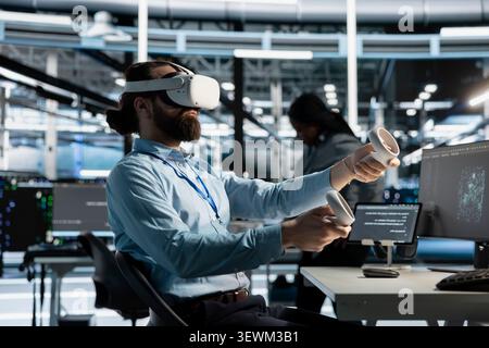 Data center technician uses a VR headset to configure server virtualization and AI automation systems in a data center. Stock Photo