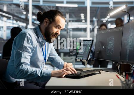 Software developer works on a computer to monitor AI systems, neural networks and server infrastructure. Stock Photo