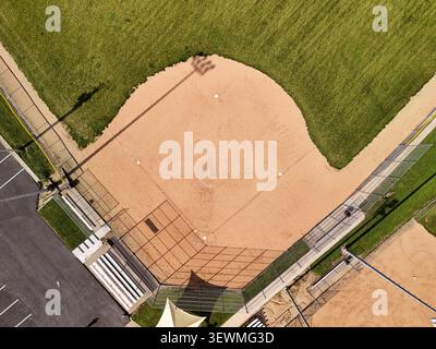 High aerial view of empty little league baseball diamond field in public community park on sunny summer day showcasing youth sports facilities Stock Photo