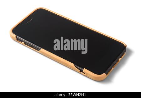 black smartphone with worn brown case isolated white background, mobile phone with old damaged protective cover, close-up view Stock Photo