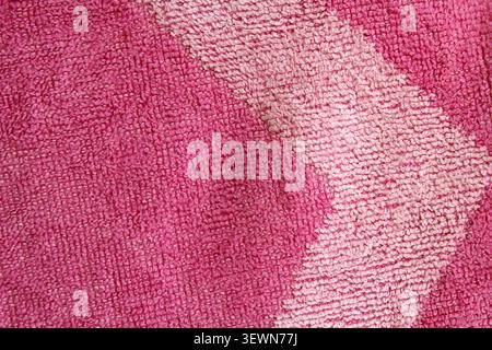 Full-frame macro texture of a pink and light pink striped terry cloth bath towel Stock Photo