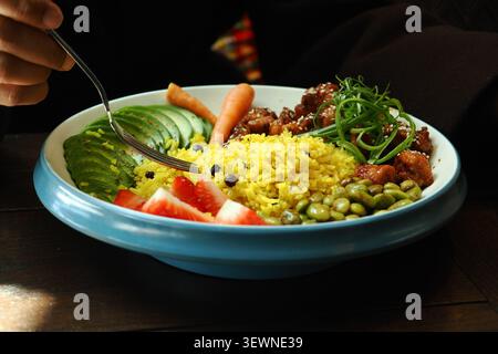 Delicious meal served in a bowl with various ingredients Stock Photo