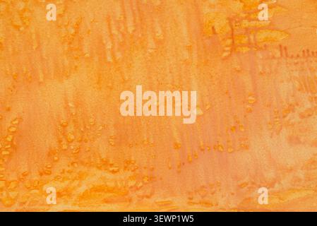 orange painted watercolor on paper background texture Stock Photo