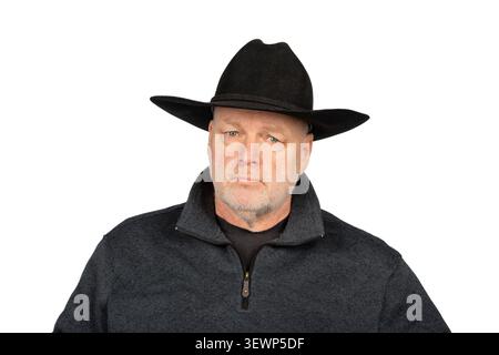 Man in Dark Western Outfit Looking at Camera Isolated on White Background Stock Photo