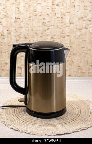 Electric kettle for heating water on the kitchen counter Stock Photo