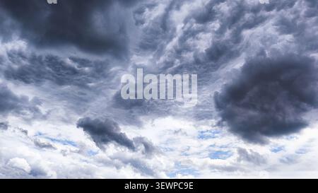 Dark storm clouds gathering across the sky before heavy rainfall. Stock Photo