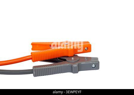 Orange and Grey Battery Booster Jumper Cable Clamps Positioned Together on White Background with Copy Space Stock Photo