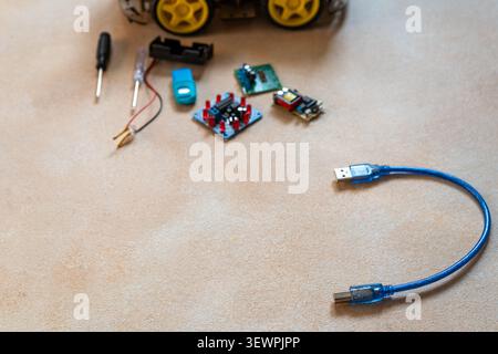 Blur background for copy space text on robotics, assembly and repair of micro components board with diodes. STEM class table top view Stock Photo