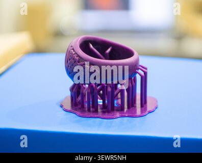 Abstract round art object printed on 3D printer from photopolymer. Model printed on 3D printer from liquid photopolymer resins. SLA. 3D printing technology. 3D Printing technology. Stock Photo