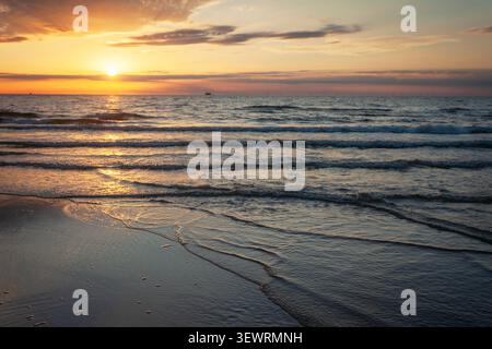 The setting sun over the sea, summer evening Stock Photo