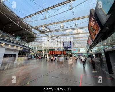 Manchester Piccadilly railway station station main concourse ( with blurred figures in motion) Stock Photo