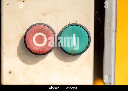 Red and green industrial start stop push buttons close up view Stock Photo