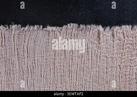 Horizontal Raw Edge Muslin Fabric Border on Black Stock Photo
