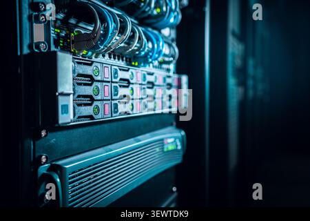 View of a server rack with networking equipment and cables in a data center in Los Angeles, California, United States. Stock Photo