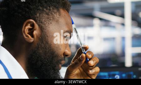 Computer scientist uses node tree software to identify equipment performance issues and data patterns. Stock Photo
