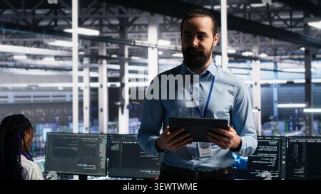 Data center manager presents machine learning hardware and predictive maintenance technology to investors. Stock Photo