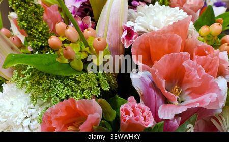 Elegant Mixed Flower Bouquet with Pink Gladiolus, Lily Buds, White Chrysanthemums, and Hypericum Berries Stock Photo