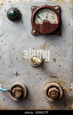 Vintage electrical appliance with ammeter, control lamp, switch and terminals for wires. Stock Photo