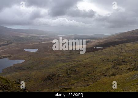 Scenic view from Conor Pass under a dramatic cloudy sky, County Kerry, Ireland Stock Photo