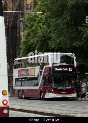 Volvo B8l ADL Enviro400XLB on route 11 to Hyvots Bank in front of the Scott Monument With trees above it boarding passengers. Stock Photo