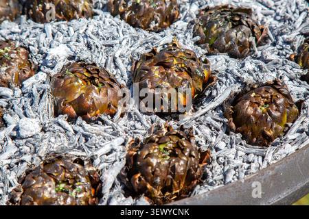 Display Of Fresh Artichokes In Simple Packaging Emphasizing Natural Textures And Earthy Tones Stock Photo