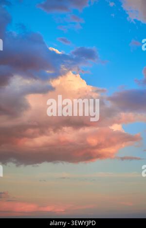Beautiful sunset colorful sky of clouds on pink background. Stock Photo