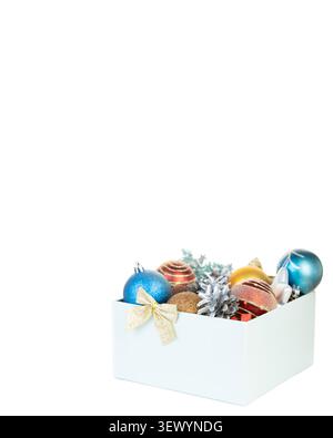 Christmas gift box with colorful baubles on right side with large white copy space background template Stock Photo