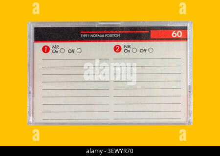 Vintage box for a compact cassette with copy space on a yellow background Stock Photo