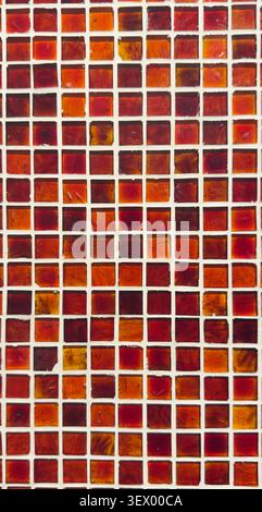 Red glass mosaic tile pattern background with geometric design Stock Photo