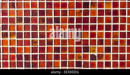Red glass mosaic tile pattern background with geometric design Stock Photo