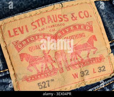 Levi Strauss model 527 leather label patch close-up on blue denim Levi's jeans Stock Photo