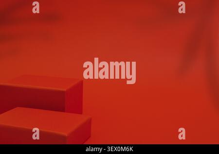Two empty red rectangular podiums of different heights on red background Stock Photo