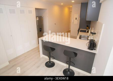Modern Open Plan Living and Dining Area with Contemporary Kitchen Interior Stock Photo