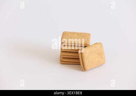 Stack Of Cream Sandwich Biscuits On White Background — Sweet Snack And Dessert Concept Stock Photo
