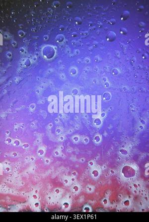 Abstract wallpaper featuring water droplets or bubbles in a purple-pink color scheme. High quality photo Stock Photo