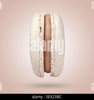 Yummy macaron in air against pink beige background Stock Photo