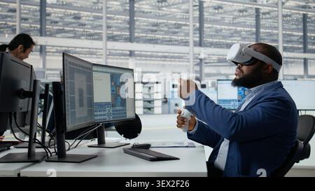 Analyzing chip architecture, VR headset and specialist in microchip factory lab. Programming integrated circuits layout, virtual reality tech and African american employee in office, camera A Stock Photo