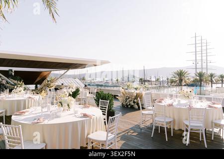 Elegant wedding dinner setup at Porto Montenegro Yacht Club Stock Photo